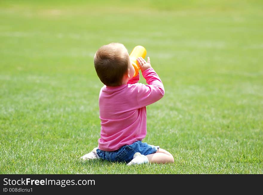 Happy baby on green grass. Happy baby on green grass