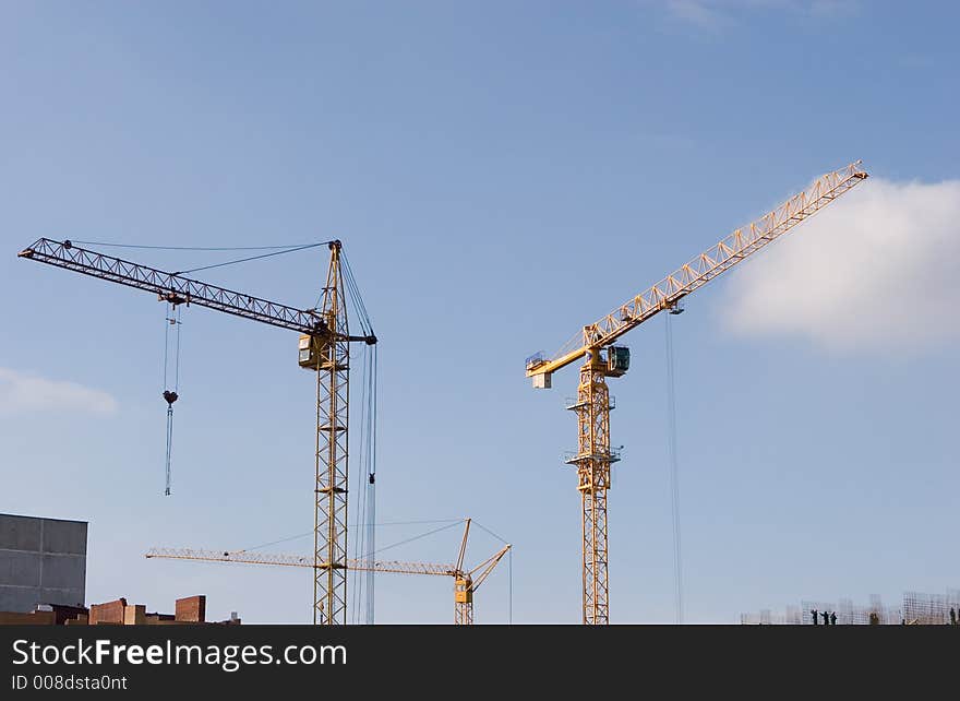 The two cranes build construction. The two cranes build construction