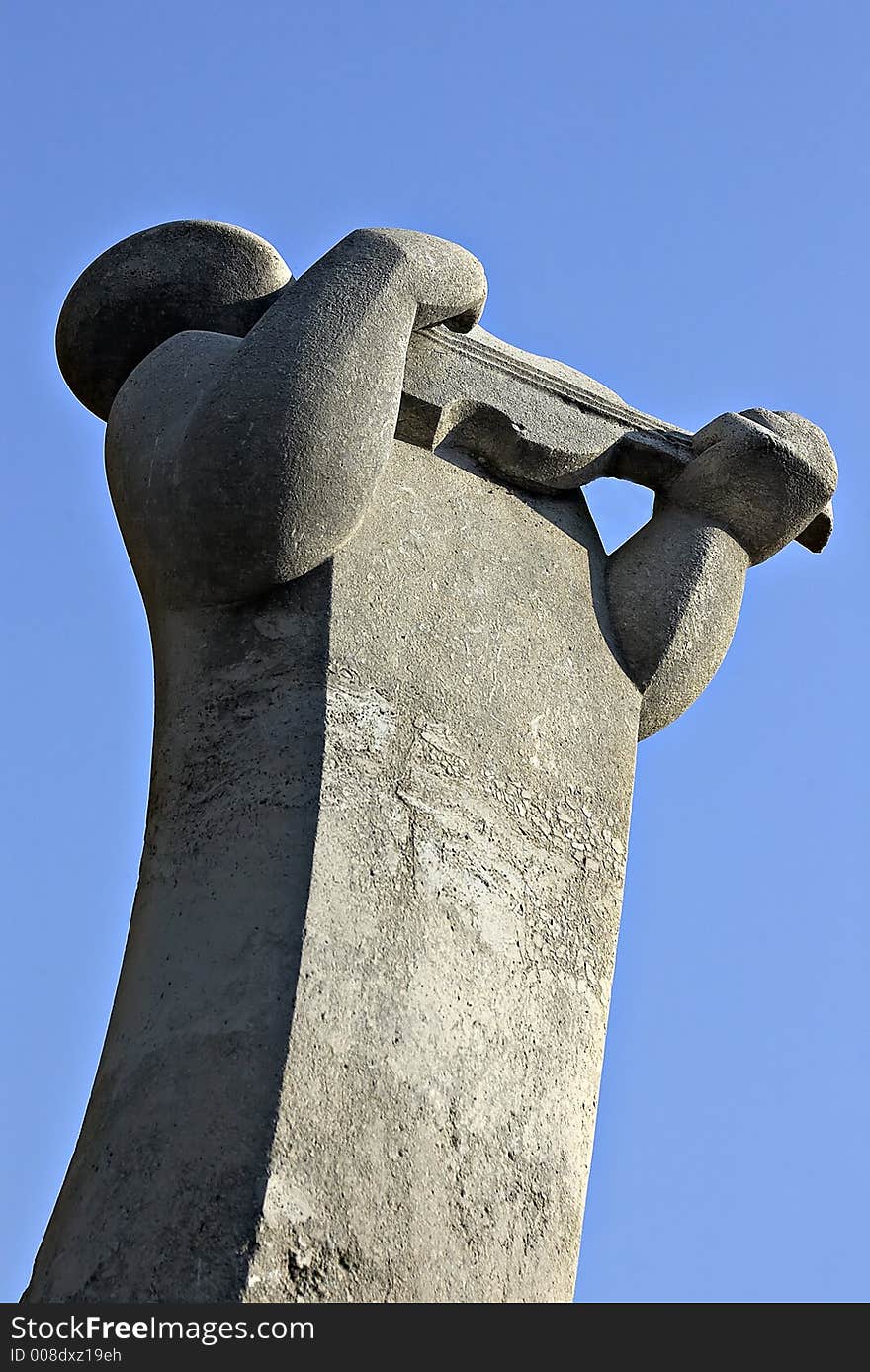 Statue of a man with violin in Budapest, Hungary