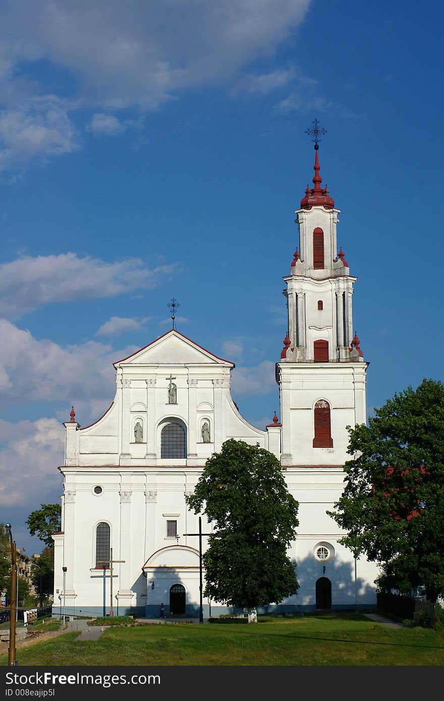 Catholic cathedral on sky background, frontal view