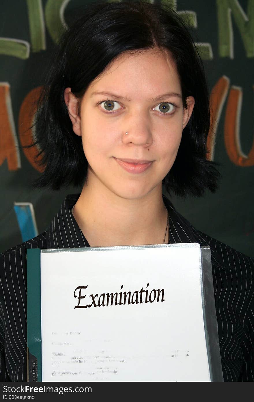 Young woman with the paper of her examination. Young woman with the paper of her examination