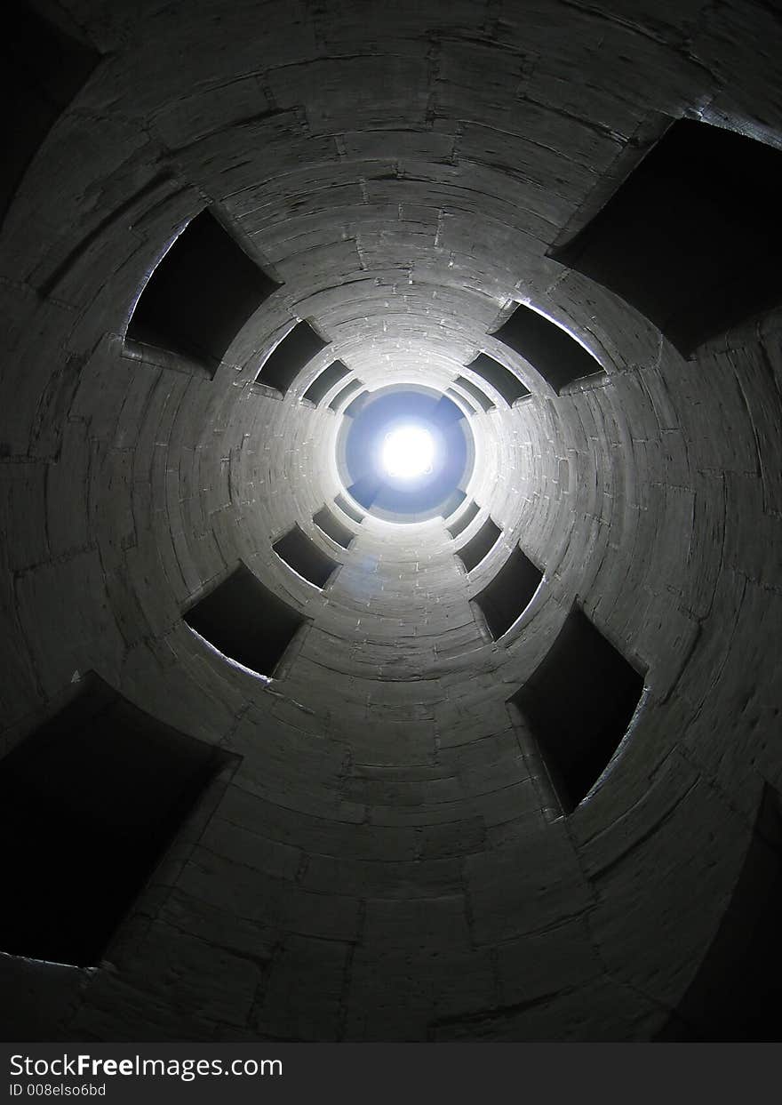 A well-hole of stairs with two flights. A well-hole of stairs with two flights