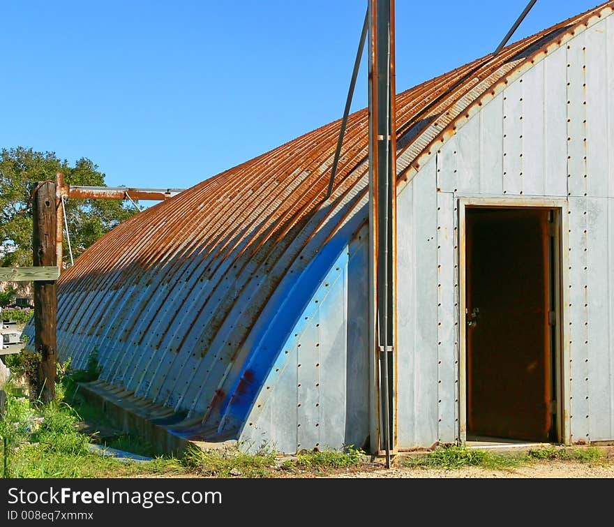 Painted rusted dome shed Galveston Texas