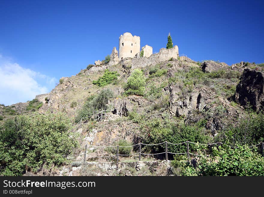 Fortified castle ruins on a crest