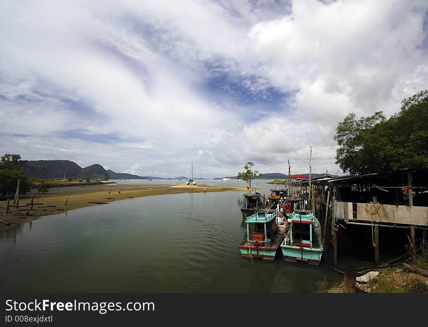 Fishing boats by the river on Langkawi Island, Malaysia