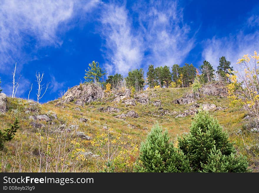 Colourful autumn view of a stony hill. Colourful autumn view of a stony hill