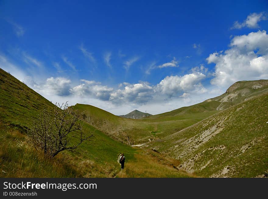 A valley surrounded by the chain of clouds. A valley surrounded by the chain of clouds