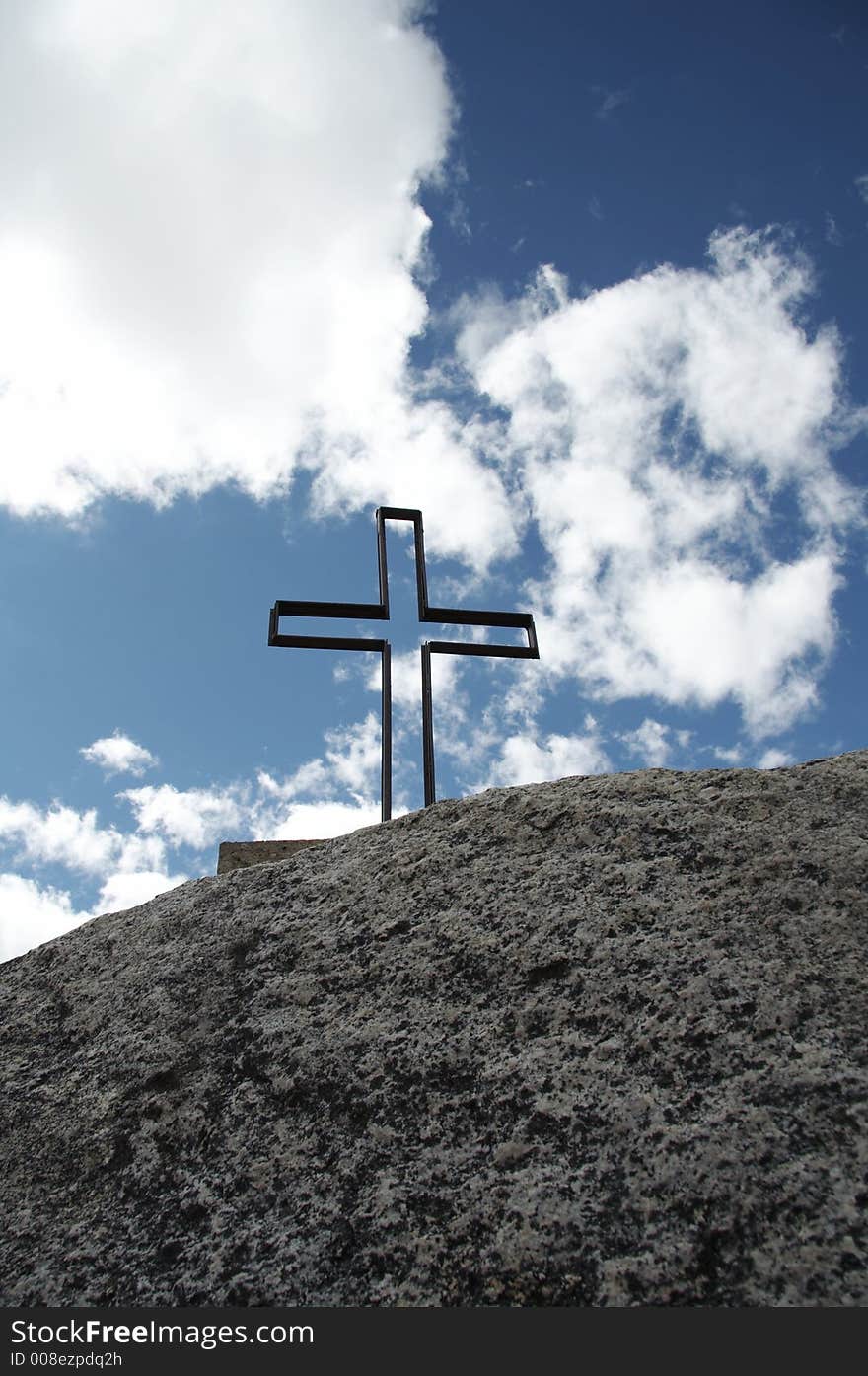 Blue,clouds,stone and cross silhouette. Blue,clouds,stone and cross silhouette