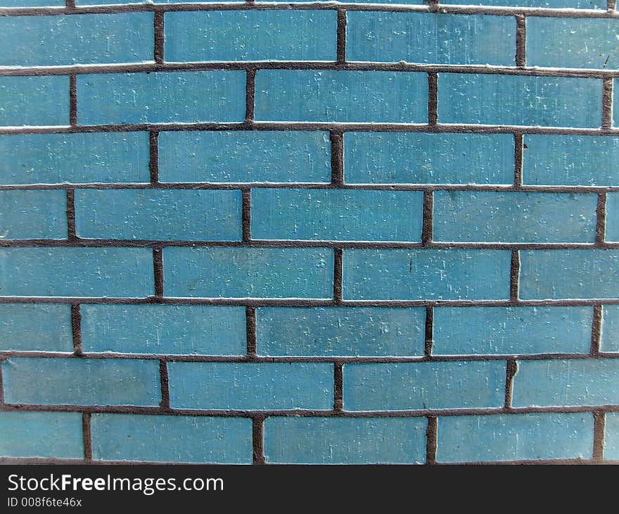 Blue brick wall with grey mortar