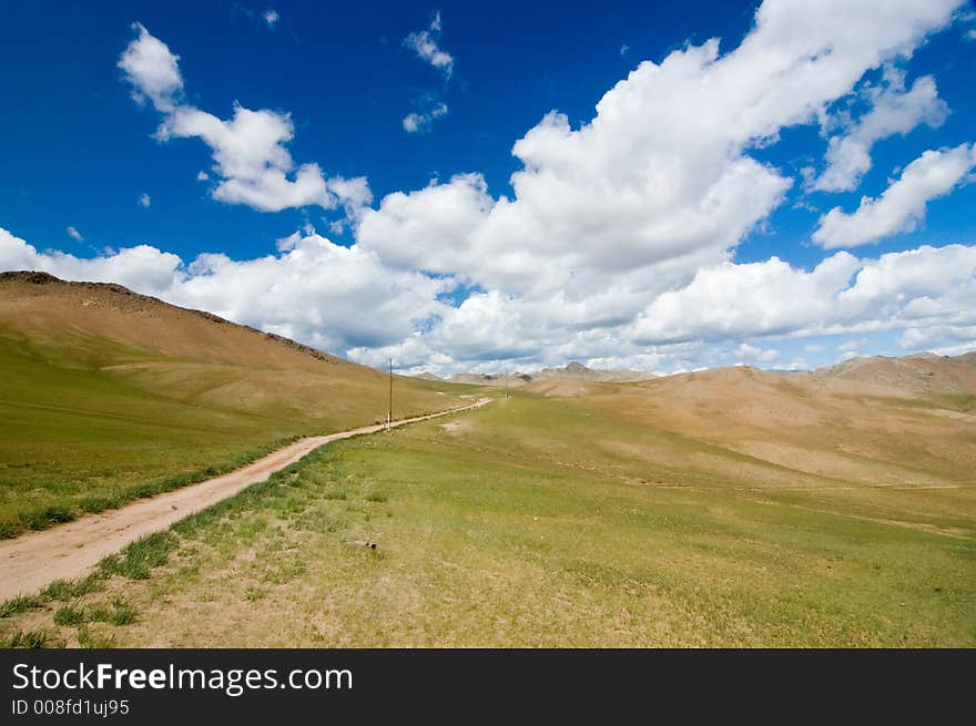 Deserted field and a road. Deserted field and a road