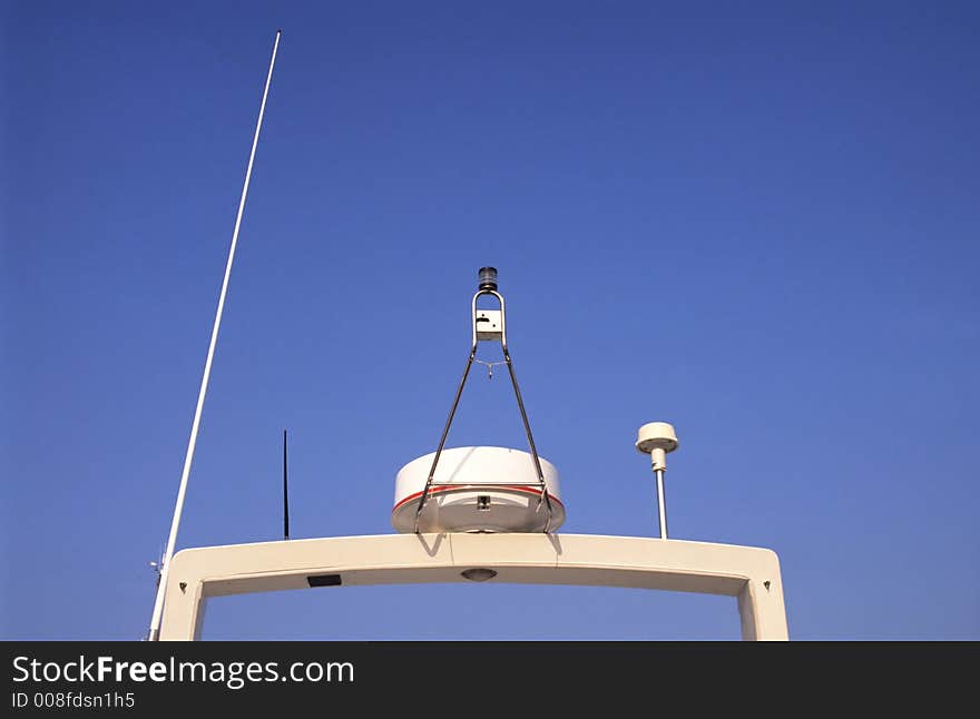 Top of a cruise ship showing radar, alarms and antenna. Top of a cruise ship showing radar, alarms and antenna.