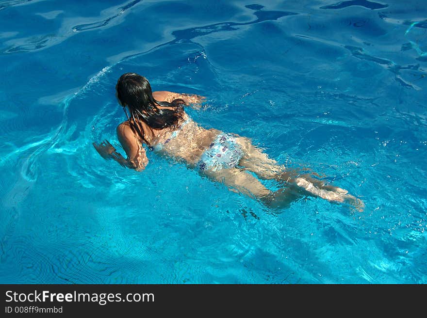 Girl swimming in pool