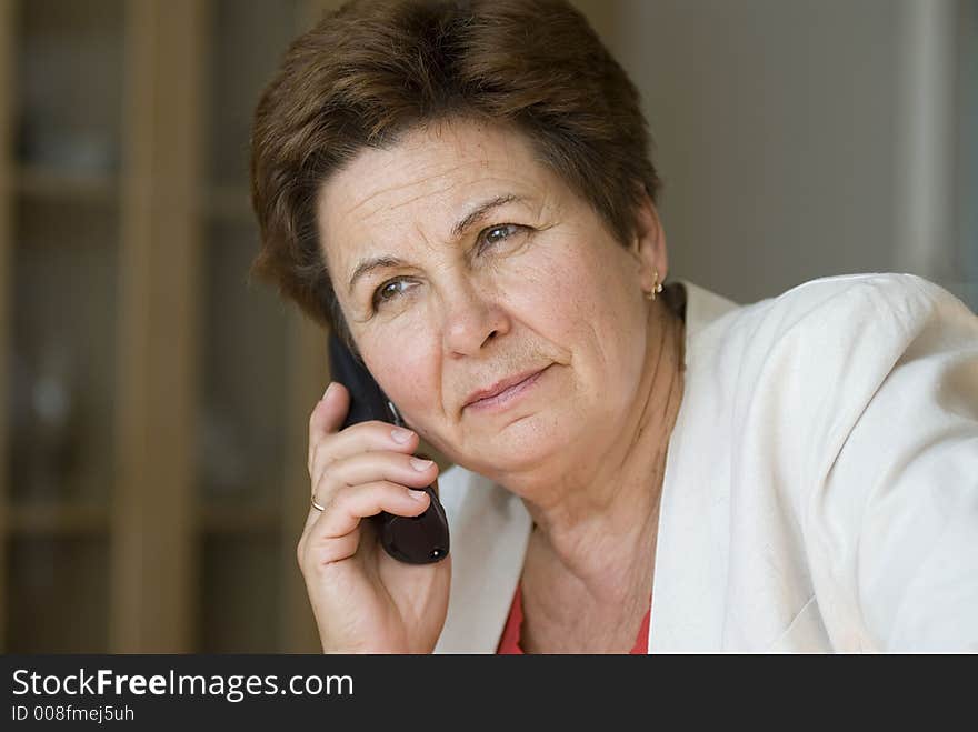 Businesswoman in the office on a phone