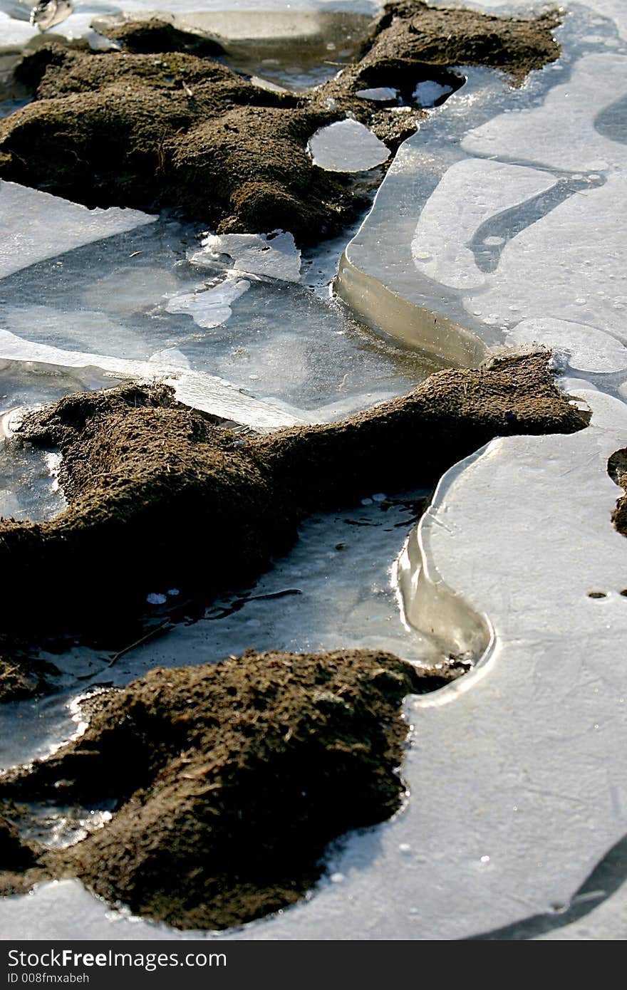 It is winter and the lake is frozen. It is winter and the lake is frozen.