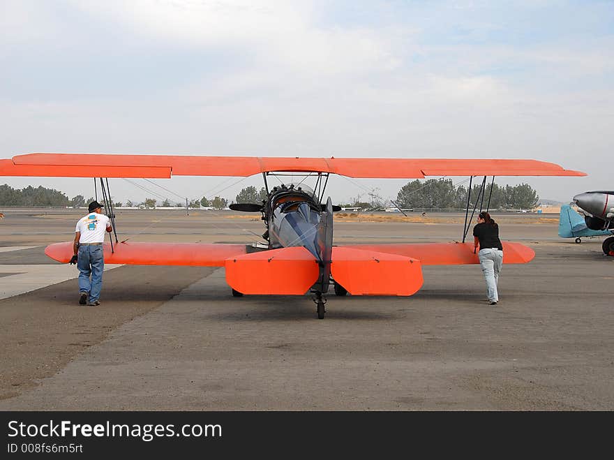 Pilots are moving plane, preparing it for a flight. Pilots are moving plane, preparing it for a flight