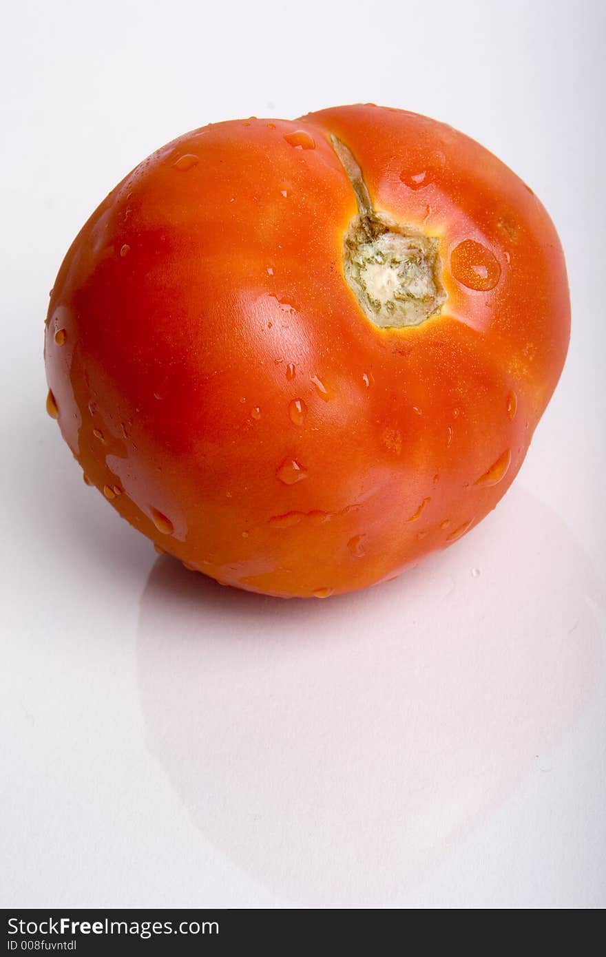 A tomato against a white background.