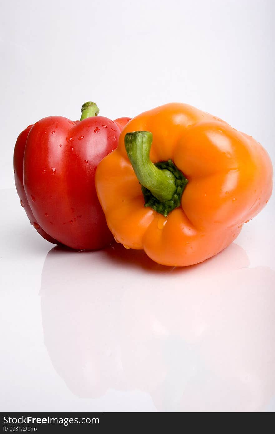 Red and orange pepper together. Red and orange pepper together