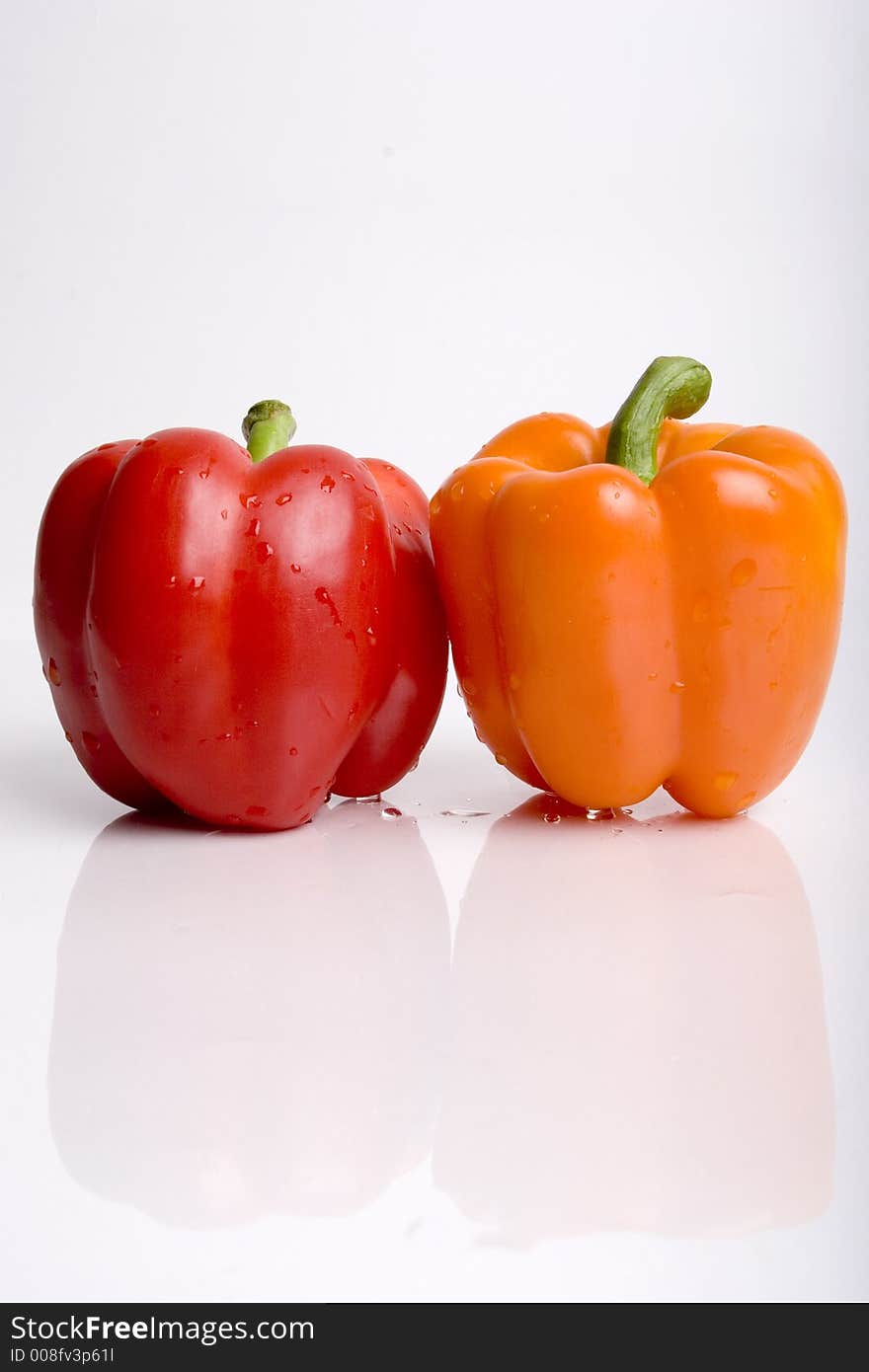 Red and orange pepper together. Red and orange pepper together