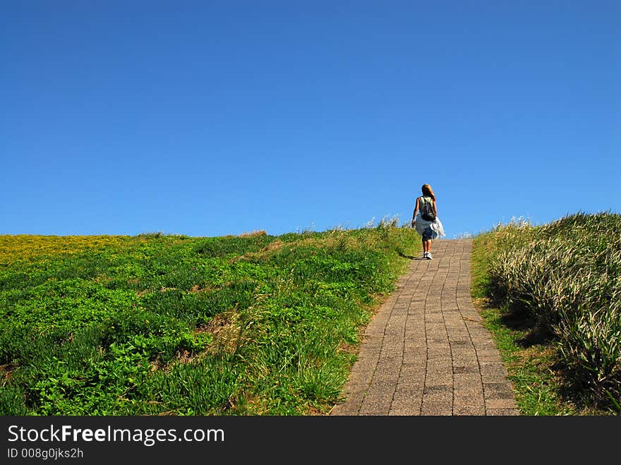 Girl scending a hill to a destination . Girl scending a hill to a destination ...