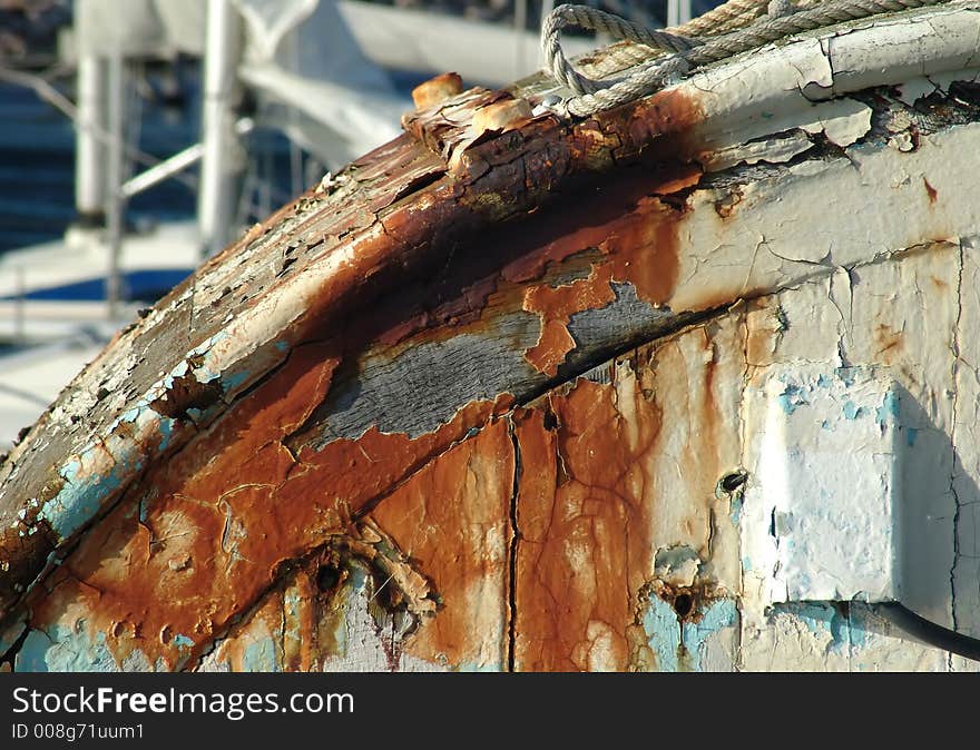 The finish of a boat flaking away. The finish of a boat flaking away