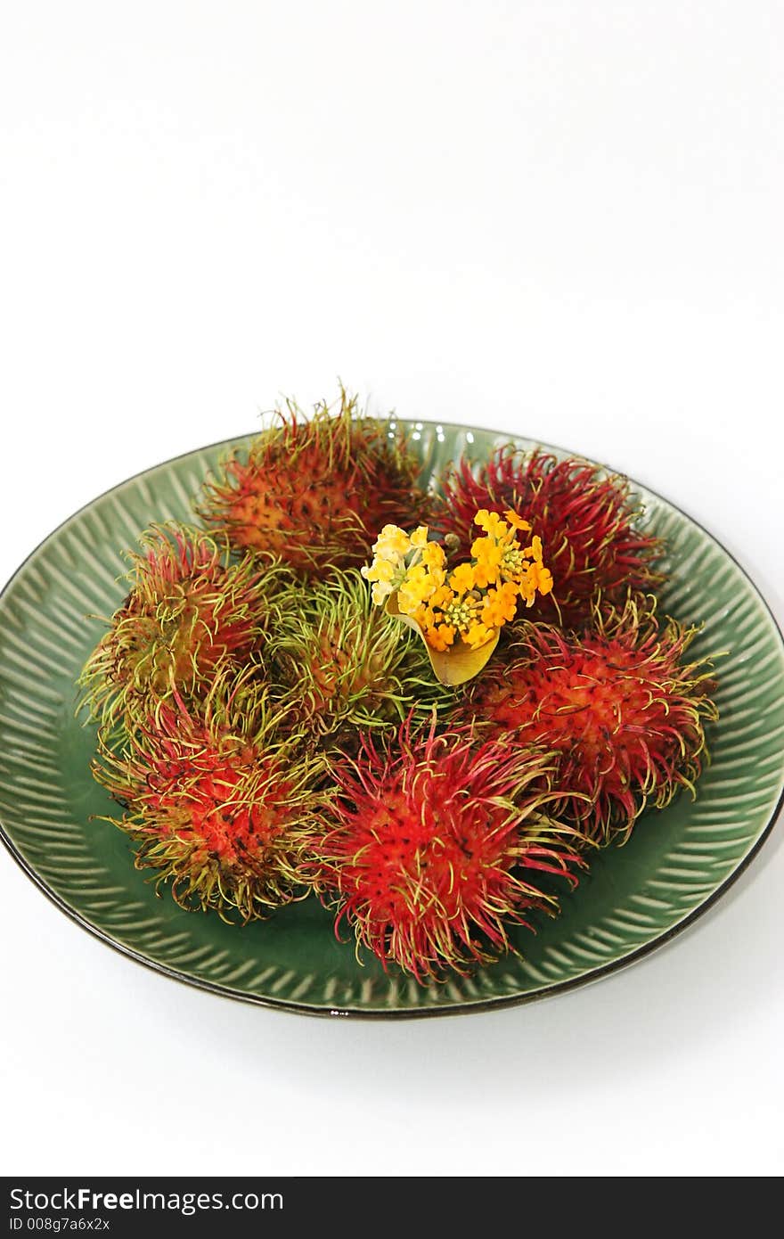 Plate of exotic fruit - rambutan. Plate of exotic fruit - rambutan