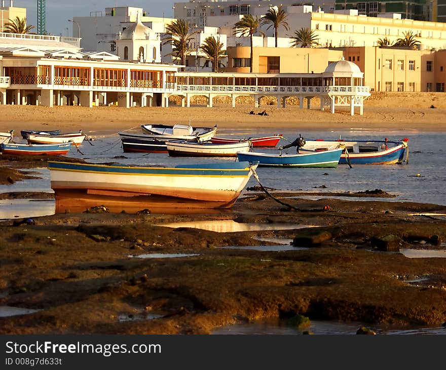 Boats in a bay at sunset