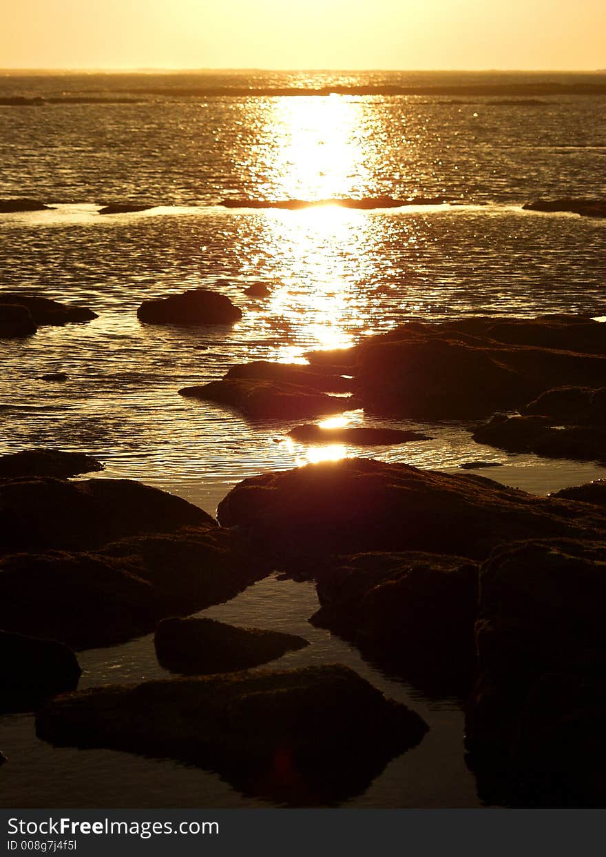 Sunset over the sea stones