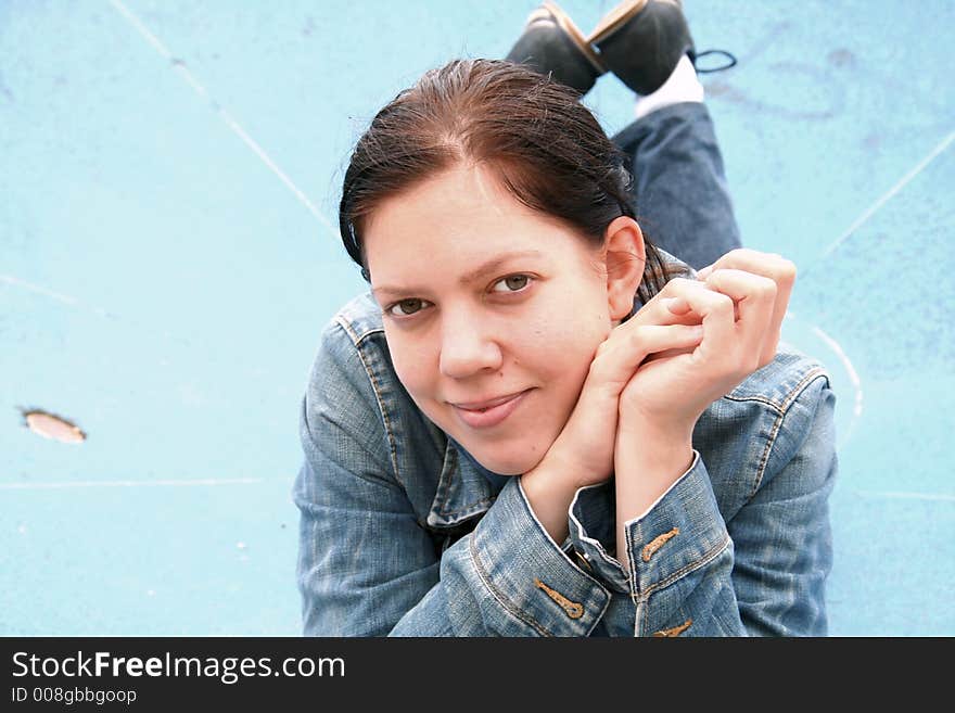 Young woman on a blue basin background. Young woman on a blue basin background