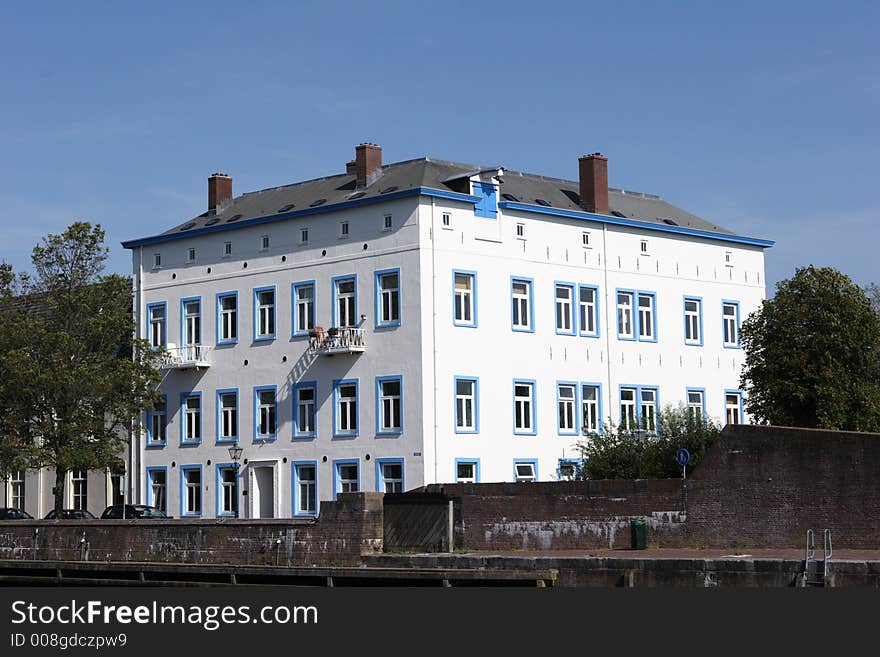 White house in Holland with blue windows