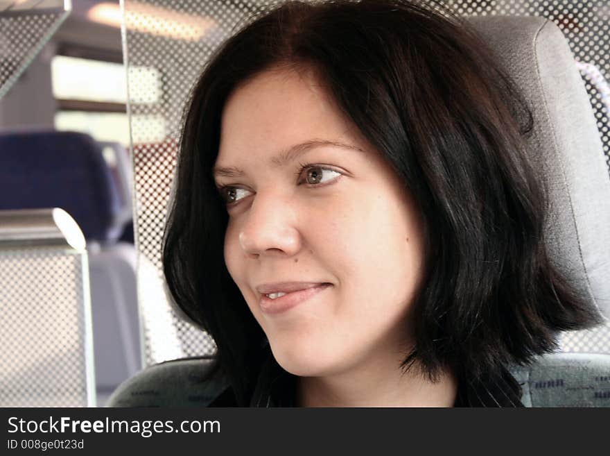 Young woman  sitting in the train. Young woman  sitting in the train