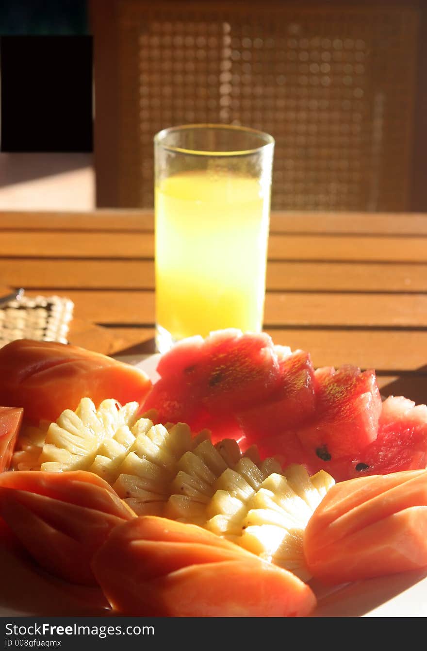 Glass of orange juice and fresh fruits. Glass of orange juice and fresh fruits