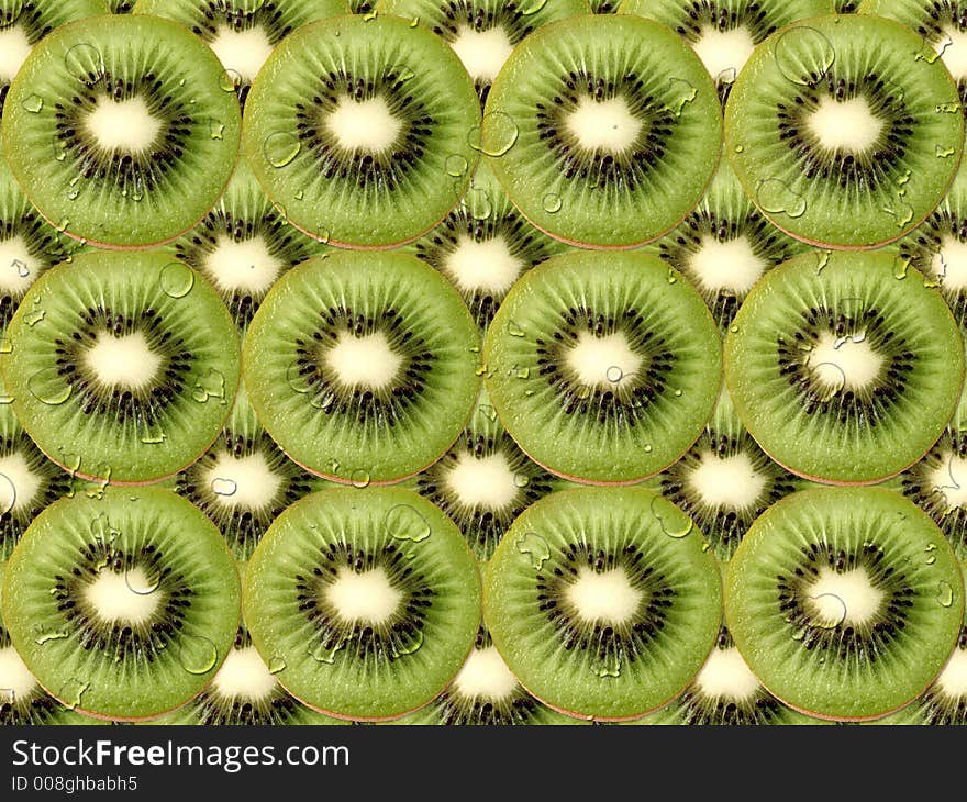 Fresh kiwi slices with water drops