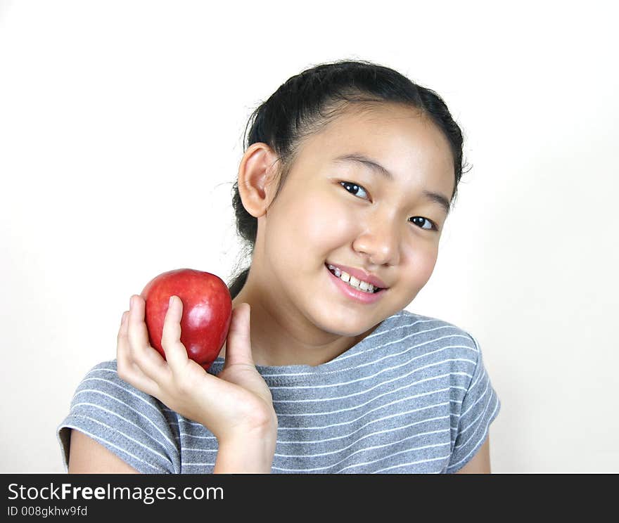 Portrait of young smart girl holding apple. Portrait of young smart girl holding apple.