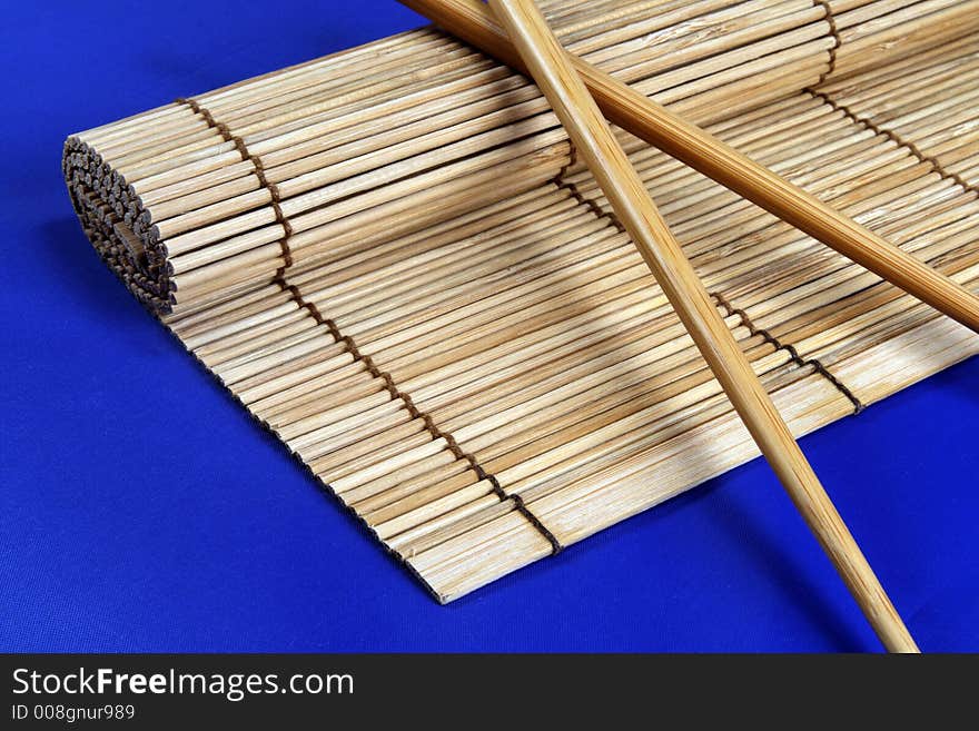 Chopsticks and bamboo mat