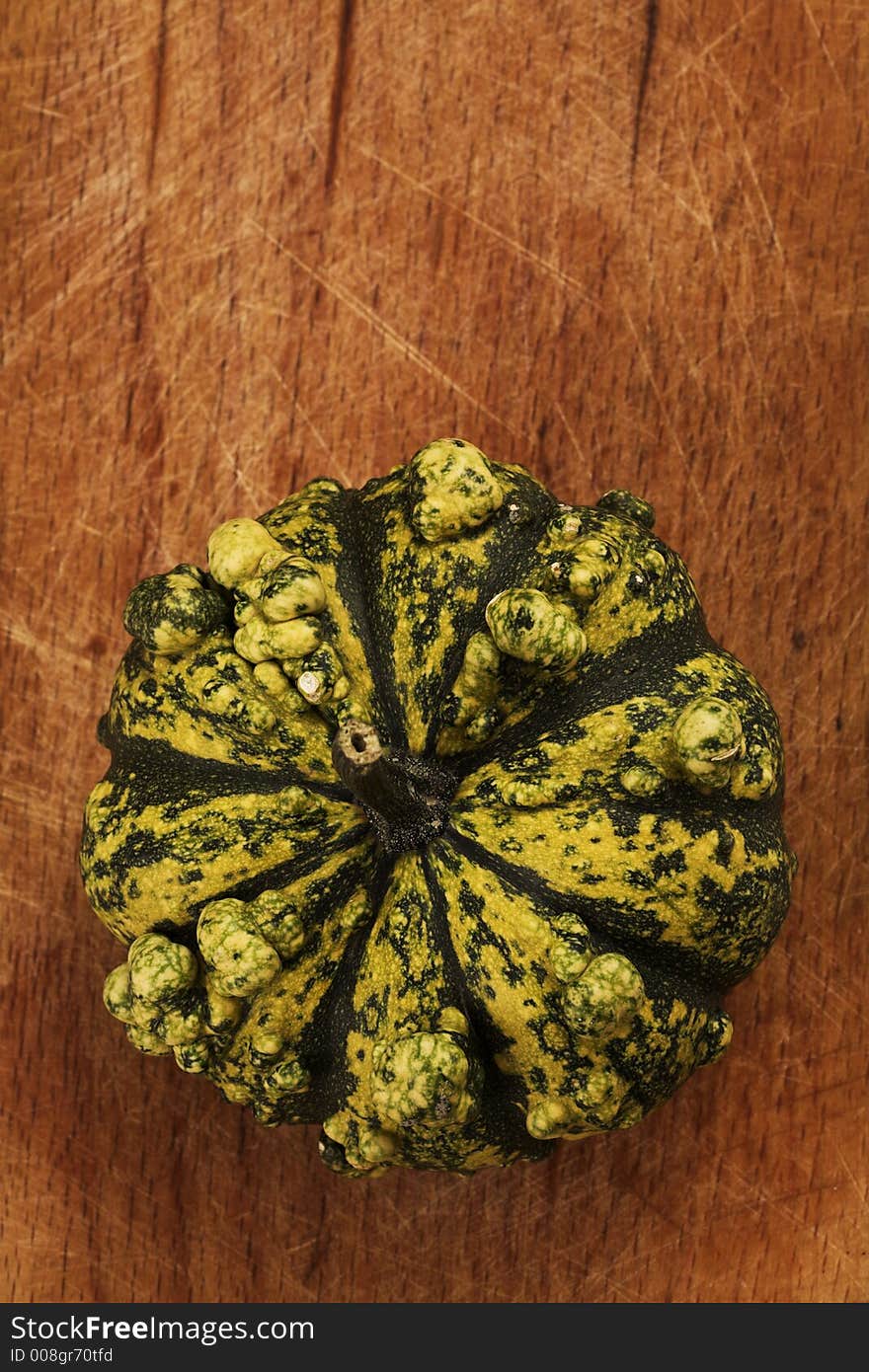 Decorative pumpkin on wooden table