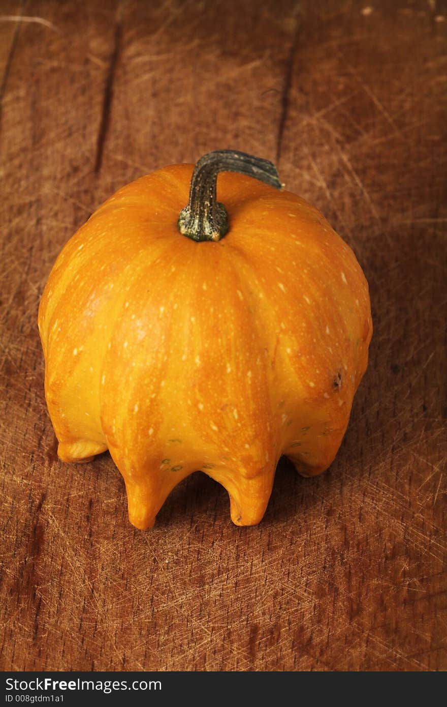 Decorative pumpkin on wooden table