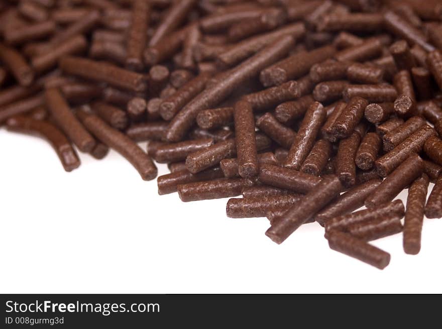 Chocolate sprinkles on white background