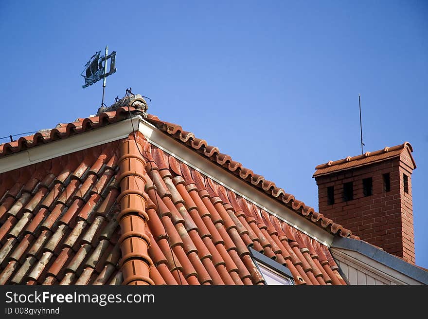 Red tiled roof and ship