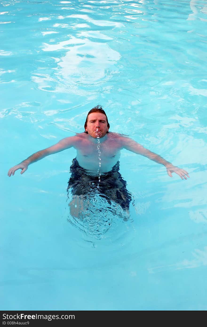 Man in a swimming pool. Man in a swimming pool