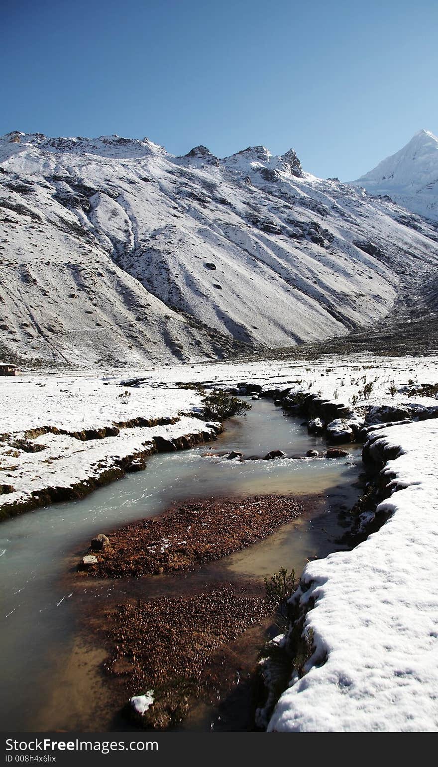 Snowcovered grassland and river in morning for mountain. Snowcovered grassland and river in morning for mountain