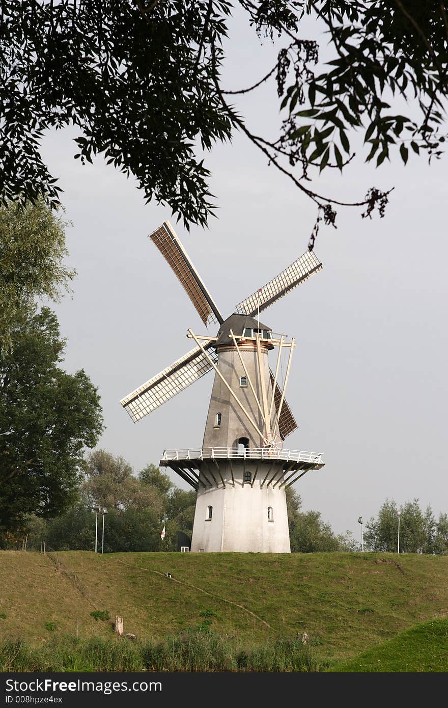 Dutch windmill on a dike