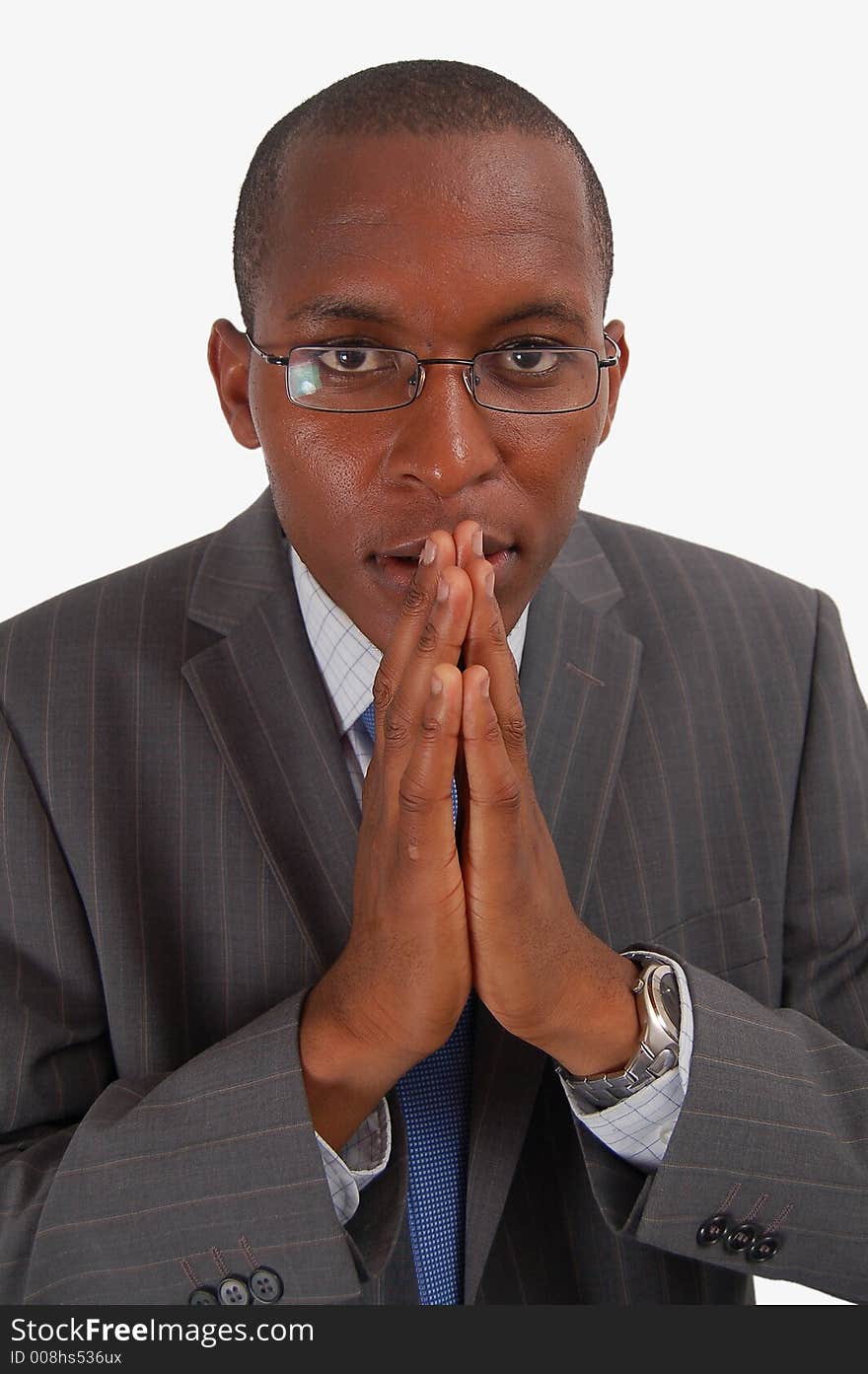 This is an image of a business man in a wishing and conniving posture. This image can represent Evil Plot, Wicked Business etc. This is an image of a business man in a wishing and conniving posture. This image can represent Evil Plot, Wicked Business etc.