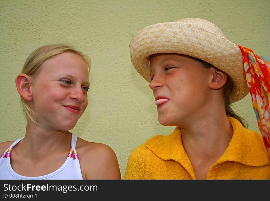 Two young girl friends laughing