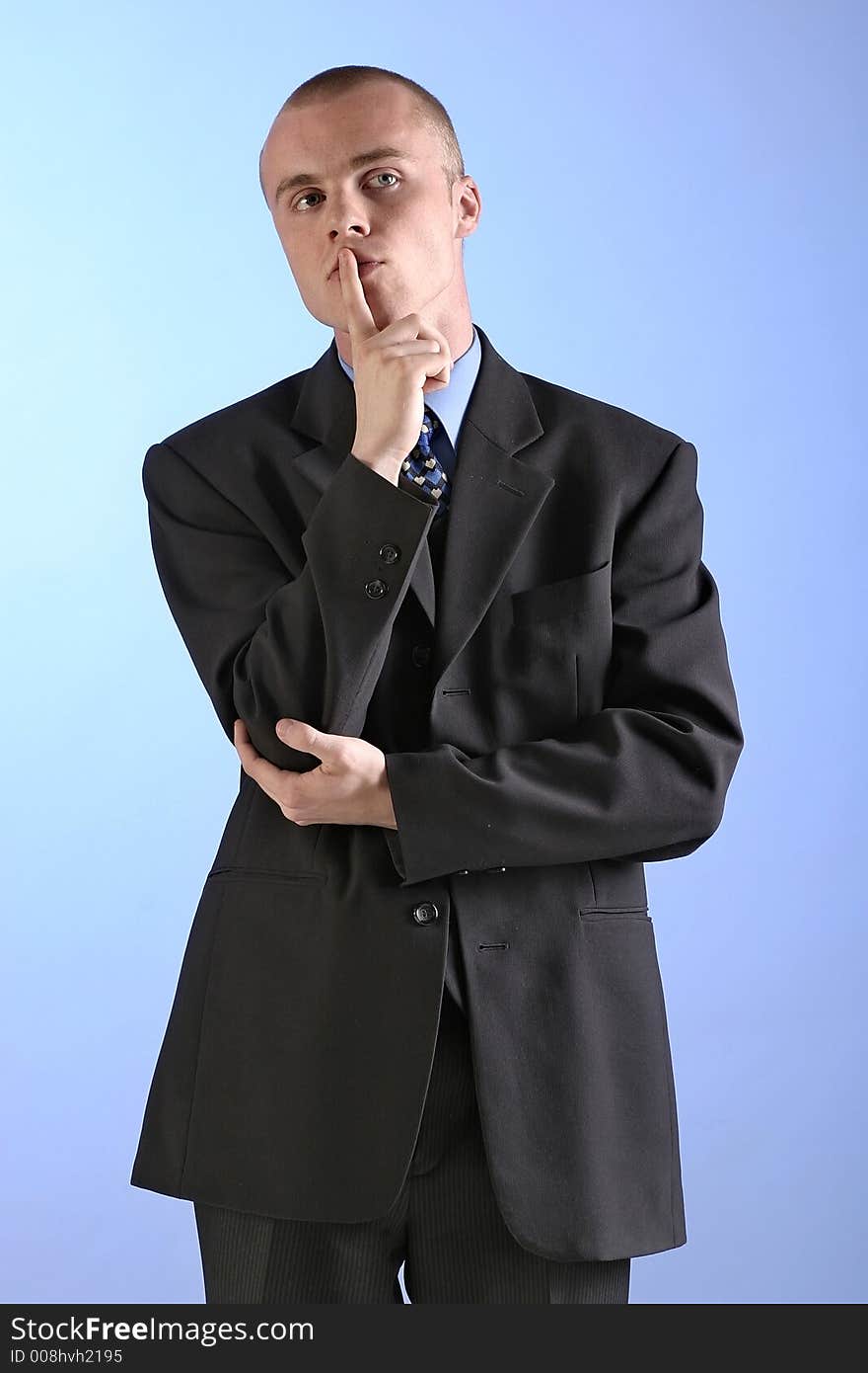 Elegant man, businesman in  a suit thinking