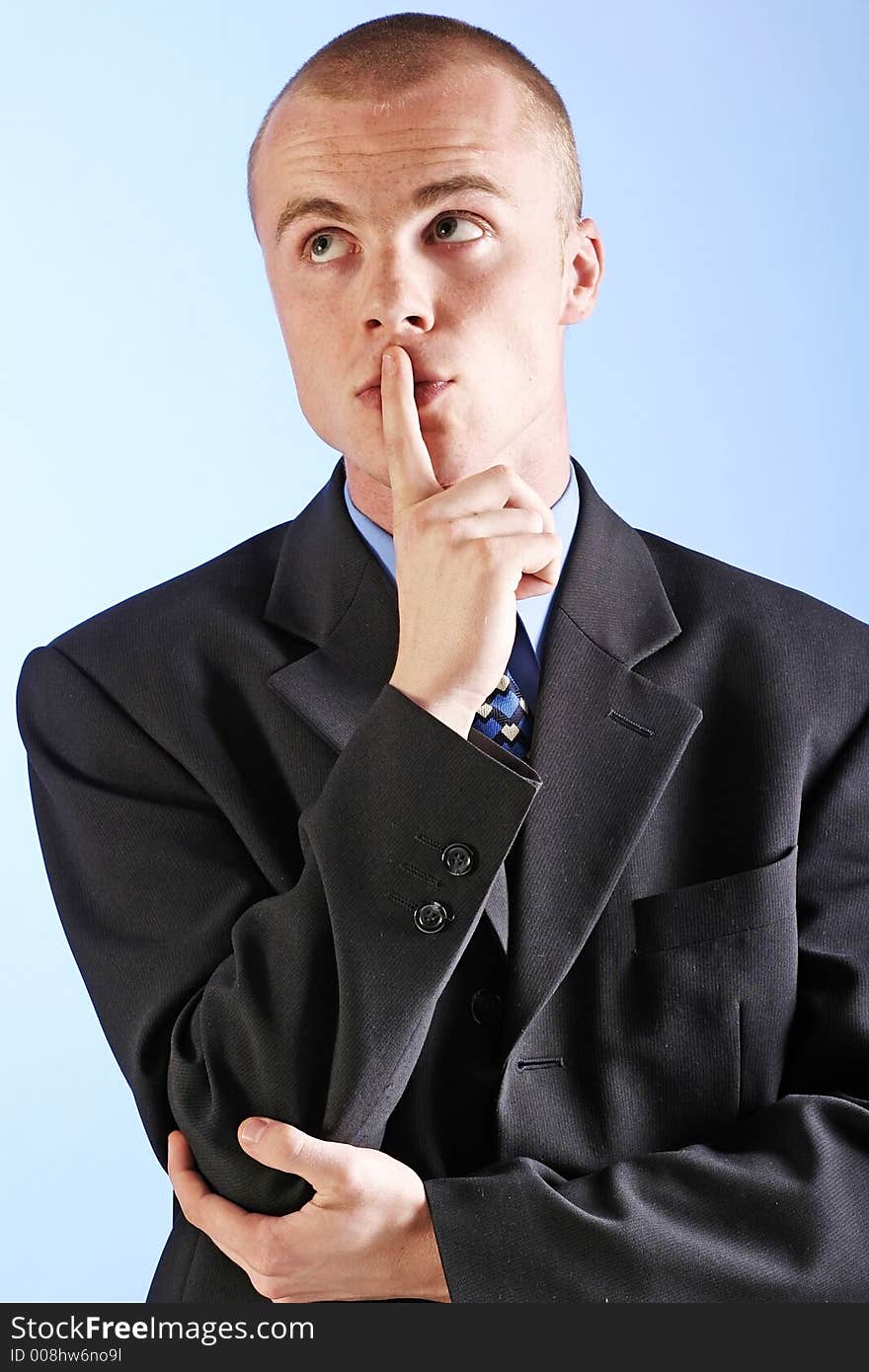 Elegant man, businesman in a suit thinking