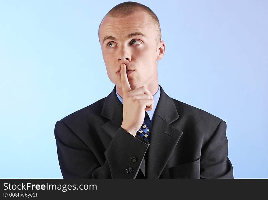 Elegant man, businesman in  a suit thinking