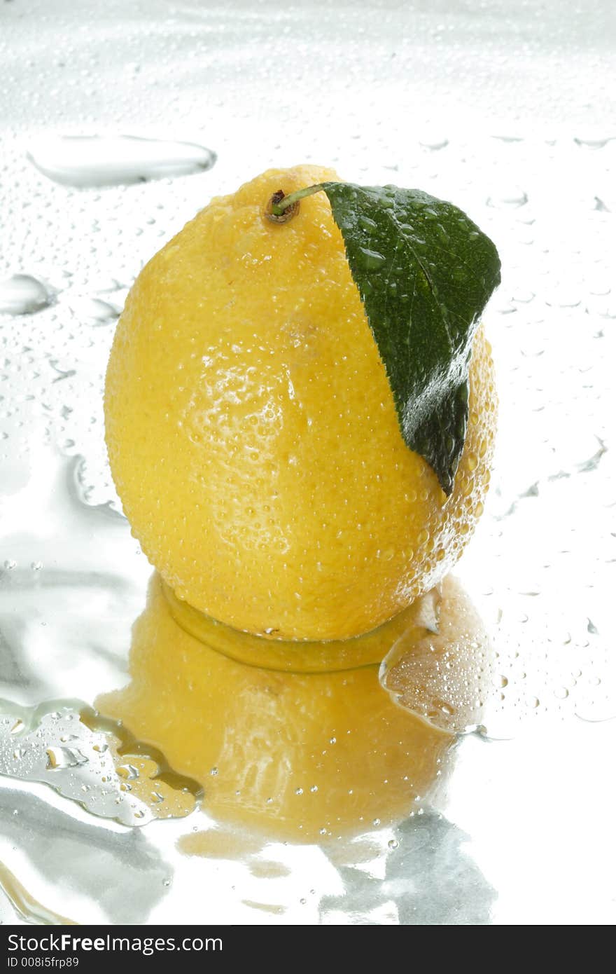 Fresh lemon and drops of water