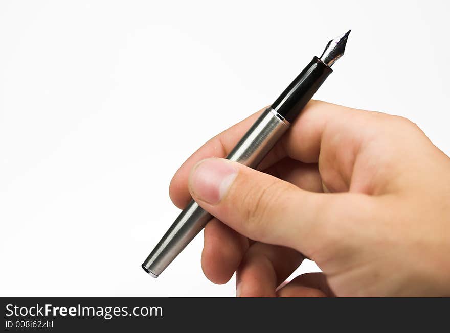 Human hand with silver pen. Human hand with silver pen