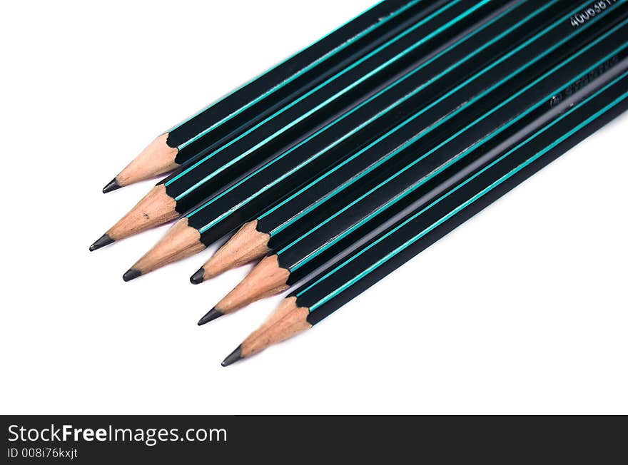 Six pencils on white background