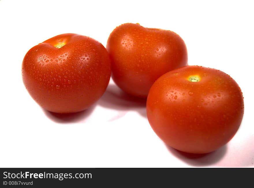 Red tomatoes on white background